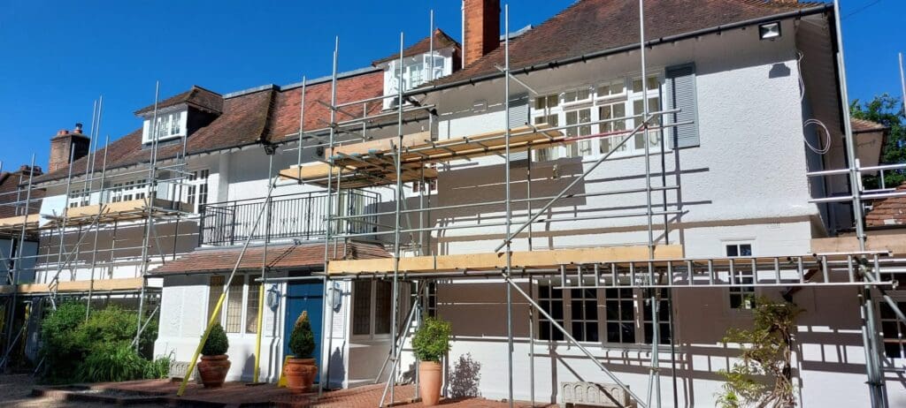 scaffolding setup for exterior painting on residential house