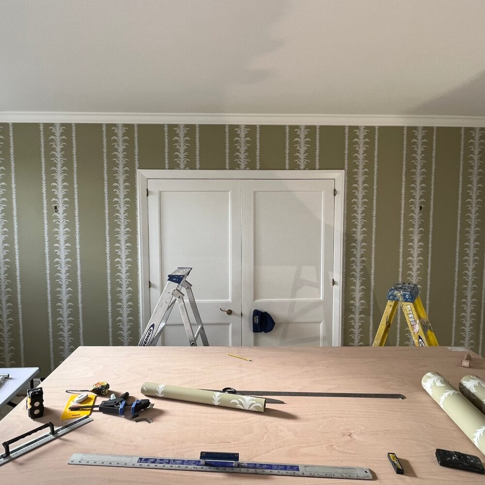 supplies and tools needed to hang wallpaper around a window