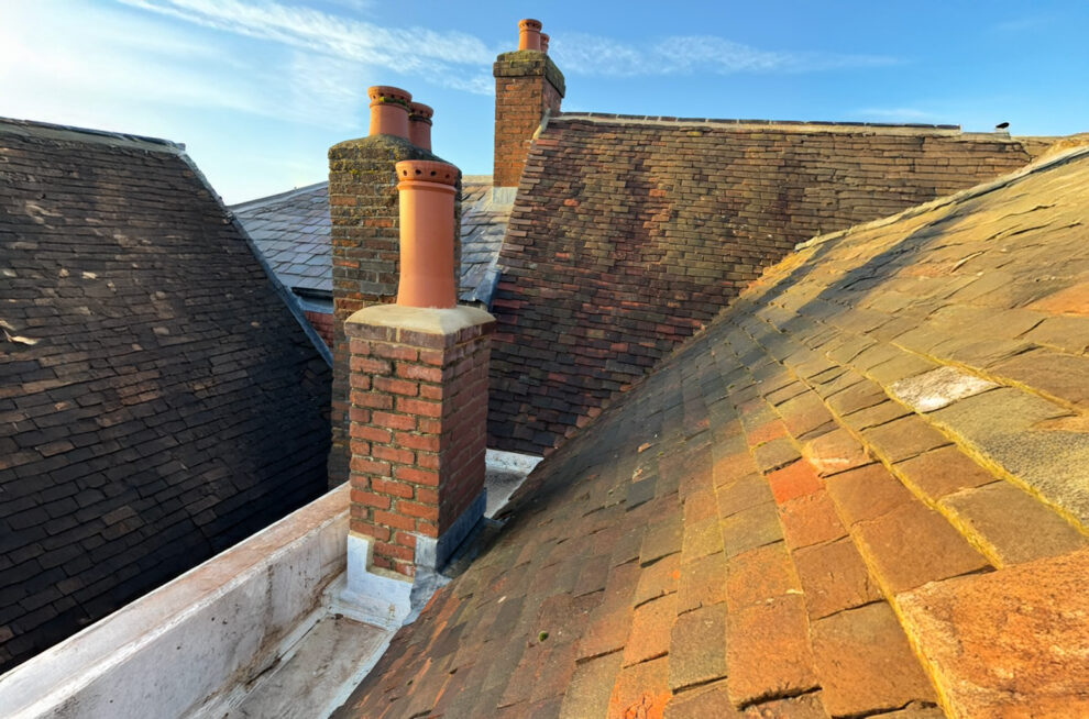 view from the roof showing exterior house maintenance work and roof repairs in progress