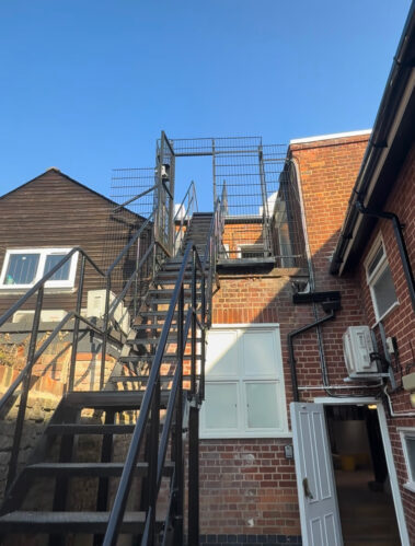 stairs railings painted and revived at the back of the property